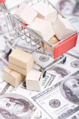 Small shopping cart and express box on the dollar