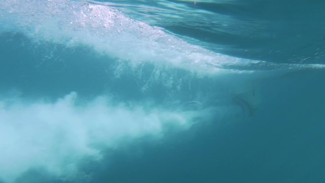 slowmotion lateral close up shot of boat propeller's in action in deep bleu sea