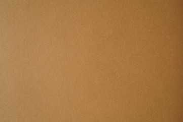 the background is a deep brown piece of cardboard paper stylish natural color