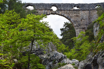 Fototapeta na wymiar Ancient aqueduct in Kemerdere Village