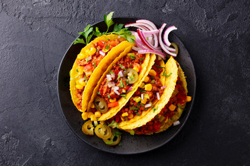Taco with beef, Mexican traditional cuisine. Dark background. Top view.