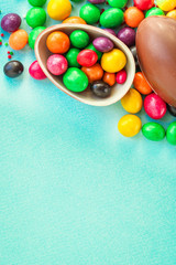 Fototapeta na wymiar chocolate egg and candy easter decor, menu concept background. top view. copy space