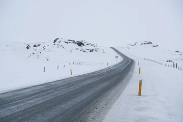 Fotobehang Rural curve highway road among the snow mountain in Iceland © Sen