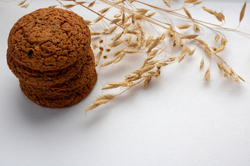 stack of whole grain cookies with outmeal isloated on white background
