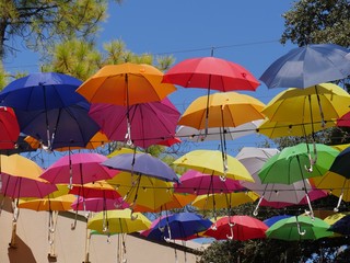 Fototapeta na wymiar Cropped shot of colorful umbrellas used as decoration at a festival