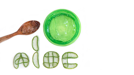 Green jar with wooden spoon and Aloe vera Cut into pieces, Placed in the letters 