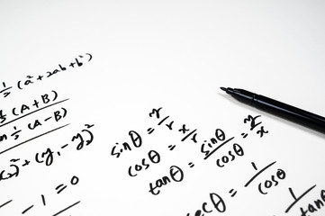 A note full of mathematical formulas. Education concept