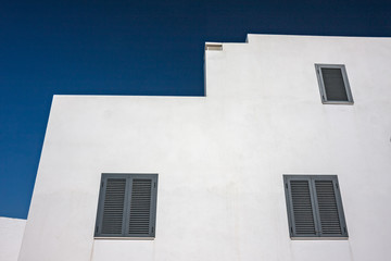 Fototapeta na wymiar The precise geometries of the sunny, white Spanish houses of the island of Formentera.