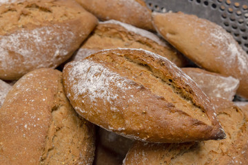 A pile of recently baked bread loafs