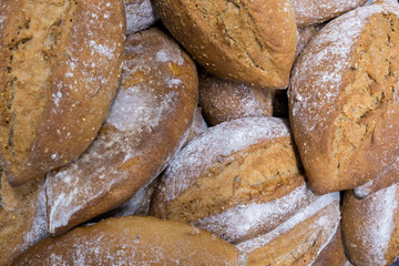 A pile of recently baked bread loafs
