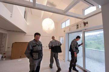 carpenters installing a balcony door