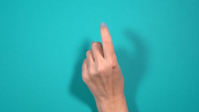 Closeup top view 4k video of beautiful manicured female hand counting from 1 to 5 using fingers.