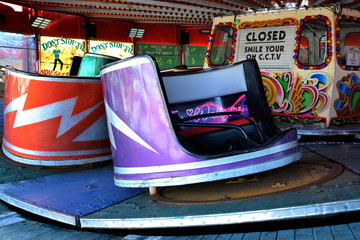 Colorful amusement park funfair rides and vintage slot machines with vibrant colours background stock photo