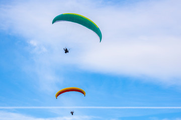Skydiver On Colorful Parachute In Sky. Active Hobbies