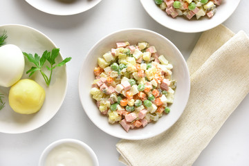 Olivier salad from boiled vegetables and sausage