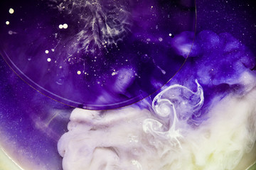 Beautiful abstraction in shades of blue and purple of liquid paints © dominikab