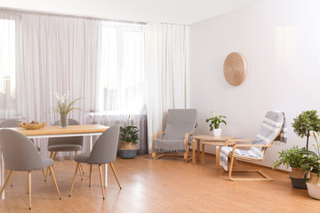 Fototapeta premium Window with stylish curtains in living room interior