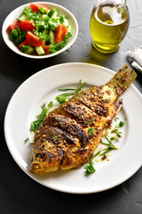 Roasted fish on plate