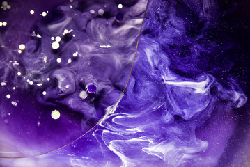 Beautiful abstraction in shades of blue and purple of liquid paints © dominikab