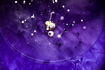 Beautiful abstraction in shades of blue and purple of liquid paints © dominikab