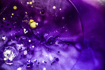 Beautiful abstraction in shades of blue and purple of liquid paints © dominikab