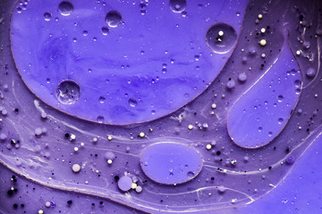 Beautiful abstraction in shades of blue and purple of liquid paints © dominikab