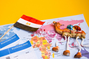 Egypt travel concept, camel magnet, egypt flag over world map