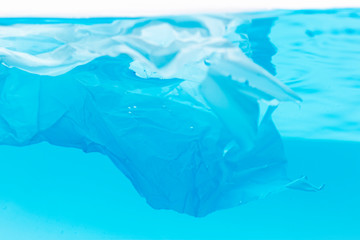 Plastic trash bag floating in the ocean Environmental problems of plastic pollutionVintage decoration,