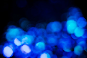 Abstract background with blurred blue lights. Space for text.