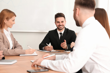 Professional business trainer working with people in office