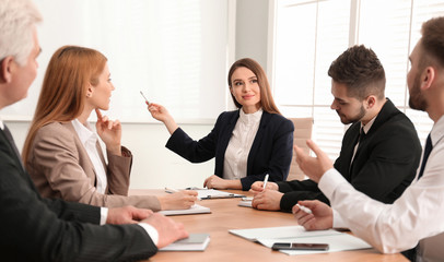 Professional business trainer working with people in office