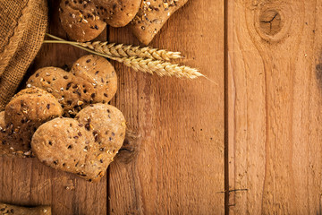 Rustic background with whole grain buns on wood
