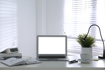 Modern laptop on office table. Stylish workplace