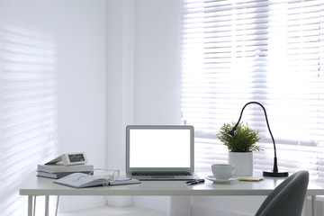 Fototapeta premium Modern laptop on office table. Stylish workplace
