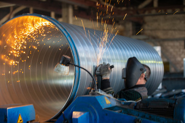 Ventilation plant. Manufacturing of ventilation metal pipes. Metal welding. Metal industry.