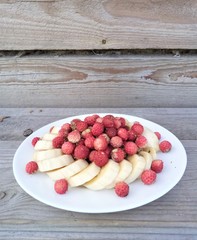  raw strawberry and banana desert on white dish