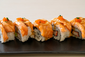 grilled salmon sushi roll with sauce