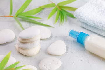 Cosmetic and Beauty spa relaxing concept. White natural zen stones scene on white marble. wellness natural therapy.