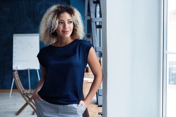 Modern young African business woman in the office with copy space.