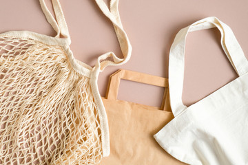 Kraft paper bag, produce cotton bag and grocery mesh bag top view. Various type of eco-friendly...