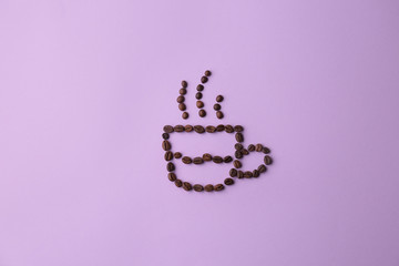 Cup made of coffee beans on lilac background, flat lay