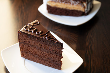 Close up photography piece of cake with chocolate glaze.