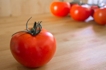 Tomatoes on top of a wood