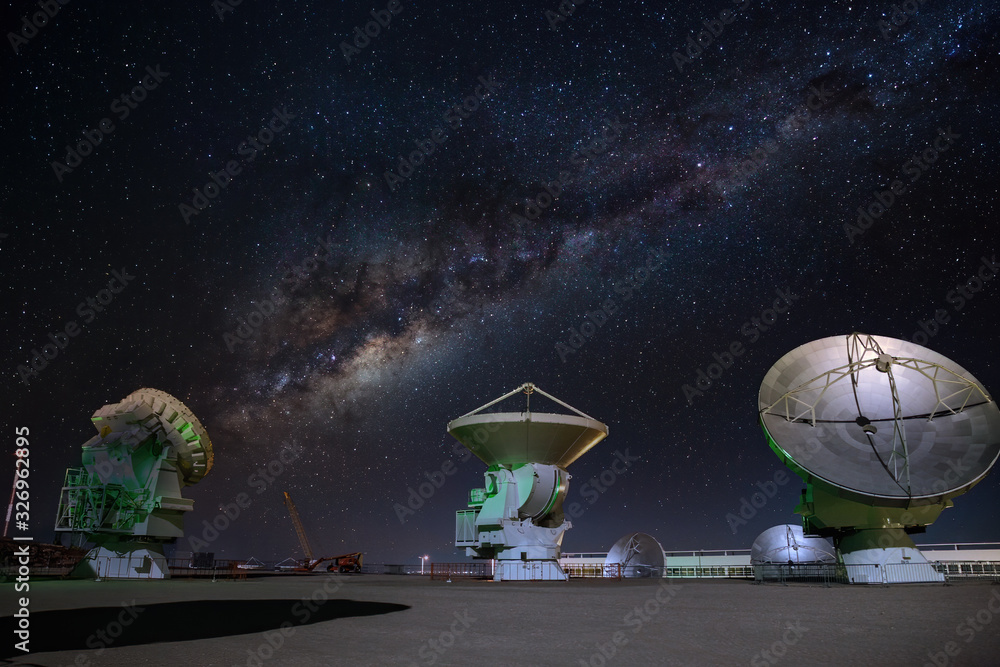 Wall mural alma radio astronomy dishes watching the sky with milky way above