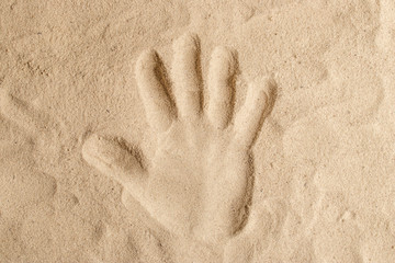 Handprint on the sand hand