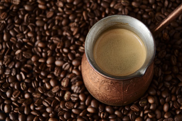 Turk stands on coffee beans