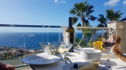 Table set for two with wine cheese and olives Los Gigantes, Tenerife, Spain