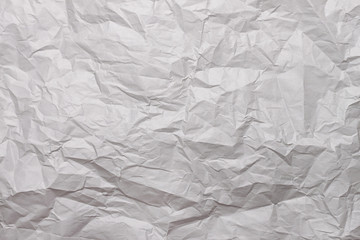 Texture of white crumpled paper. The background for the text. Blank for design.