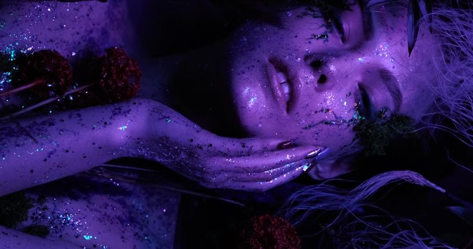 Beautiful high fashion model, cosplay avatar girl lies among the magical fog in the forests of the planet Pandora in neon colors and beautiful glows, shot in 4K close-up, bright and saturated