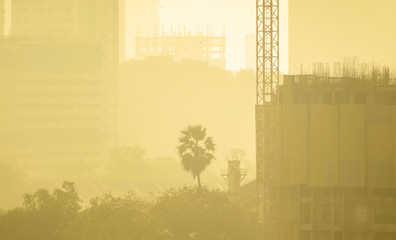 Smog and haze envelop buildings under construction in a residential district in Kandivali East in...